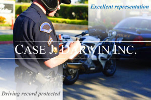 Police officer writing a ticket in front of a motorcycle and a car, with overlay text reading "Excellent Representation, Driving Record Protected, Case J. Darwin, INC."