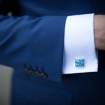 suit with blue cufflink
