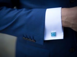 suit with blue cufflink